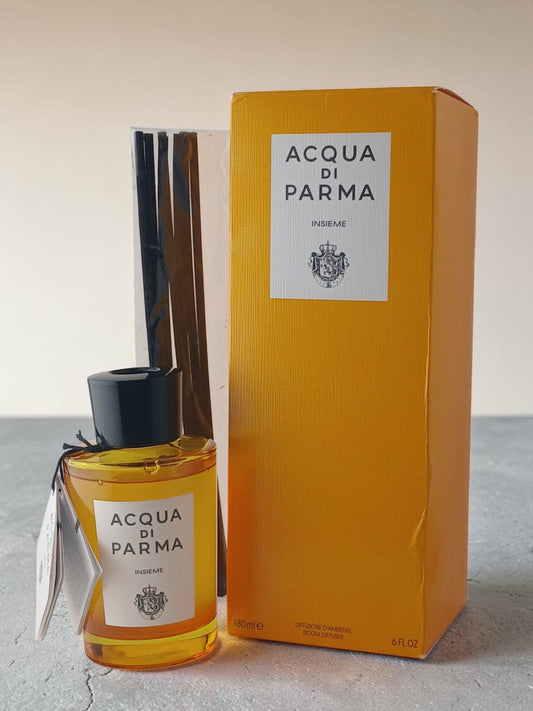Department Store UK Acqua di Parma Insieme room diffuser with yellow glass bottle, black cap, reeds, and gift box.