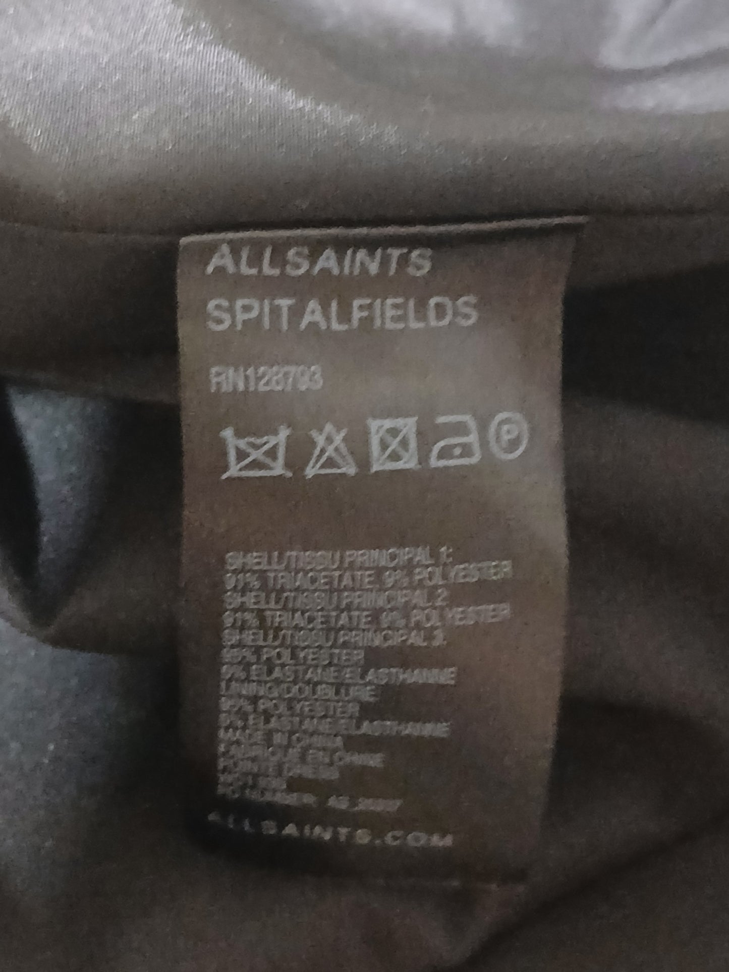 Department Store UK AllSaints Spitalfields dress care label showing fabric composition and washing instructions