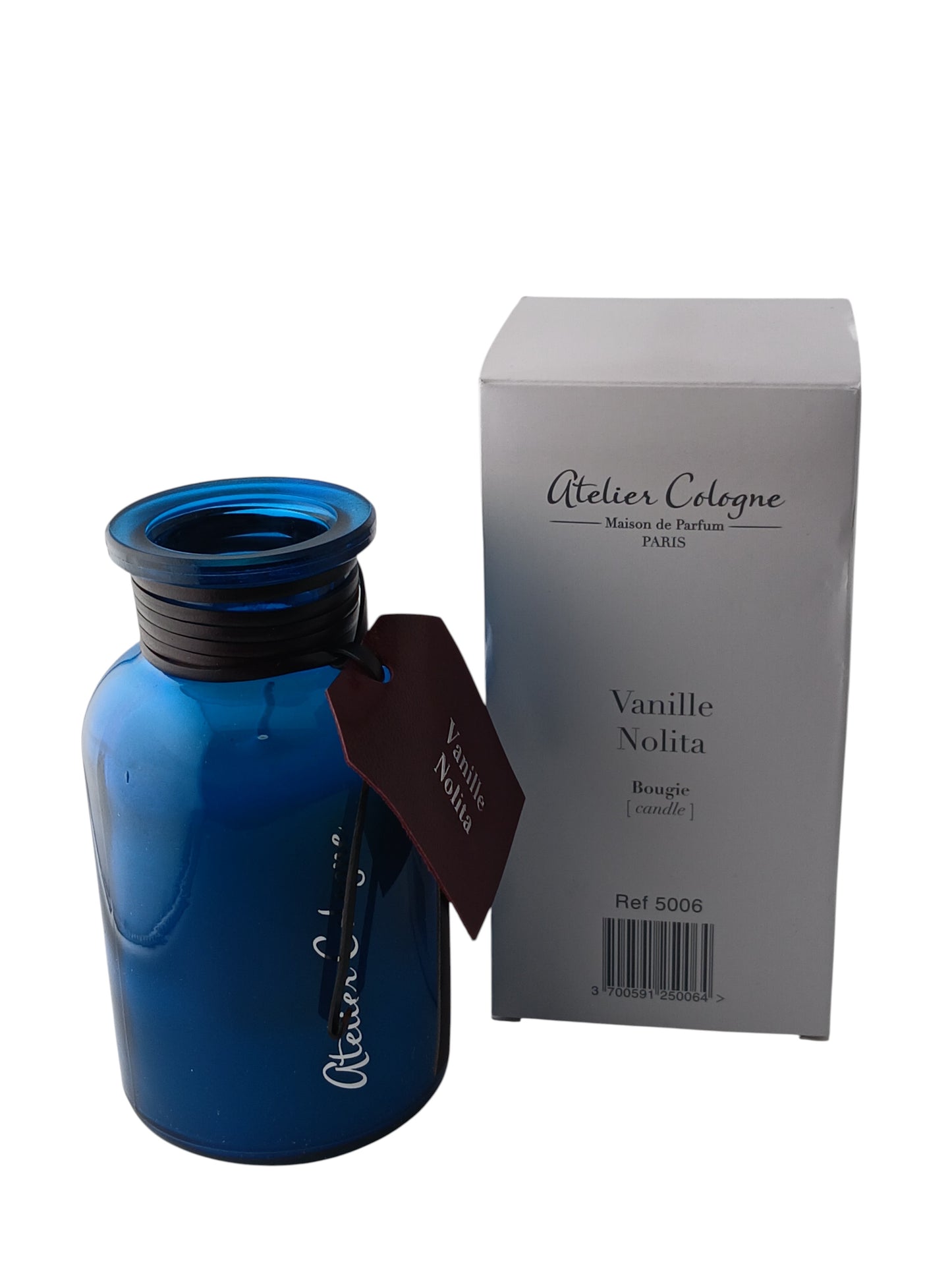 Department Store UK Atelier Cologne Vanille Nolita scented candle in a blue glass jar with matching white box