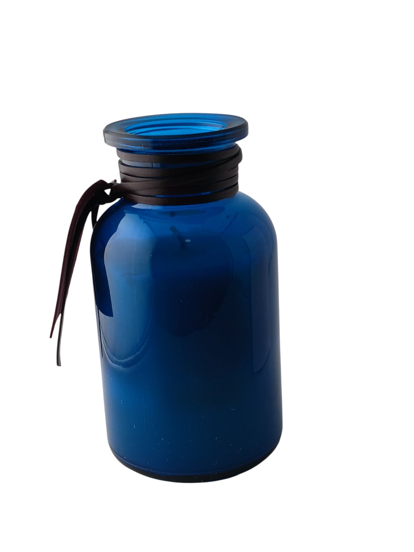 Department Store UK Atelier Cologne Vanille Nolita scented candle in a blue glass jar with a leather neck wrap