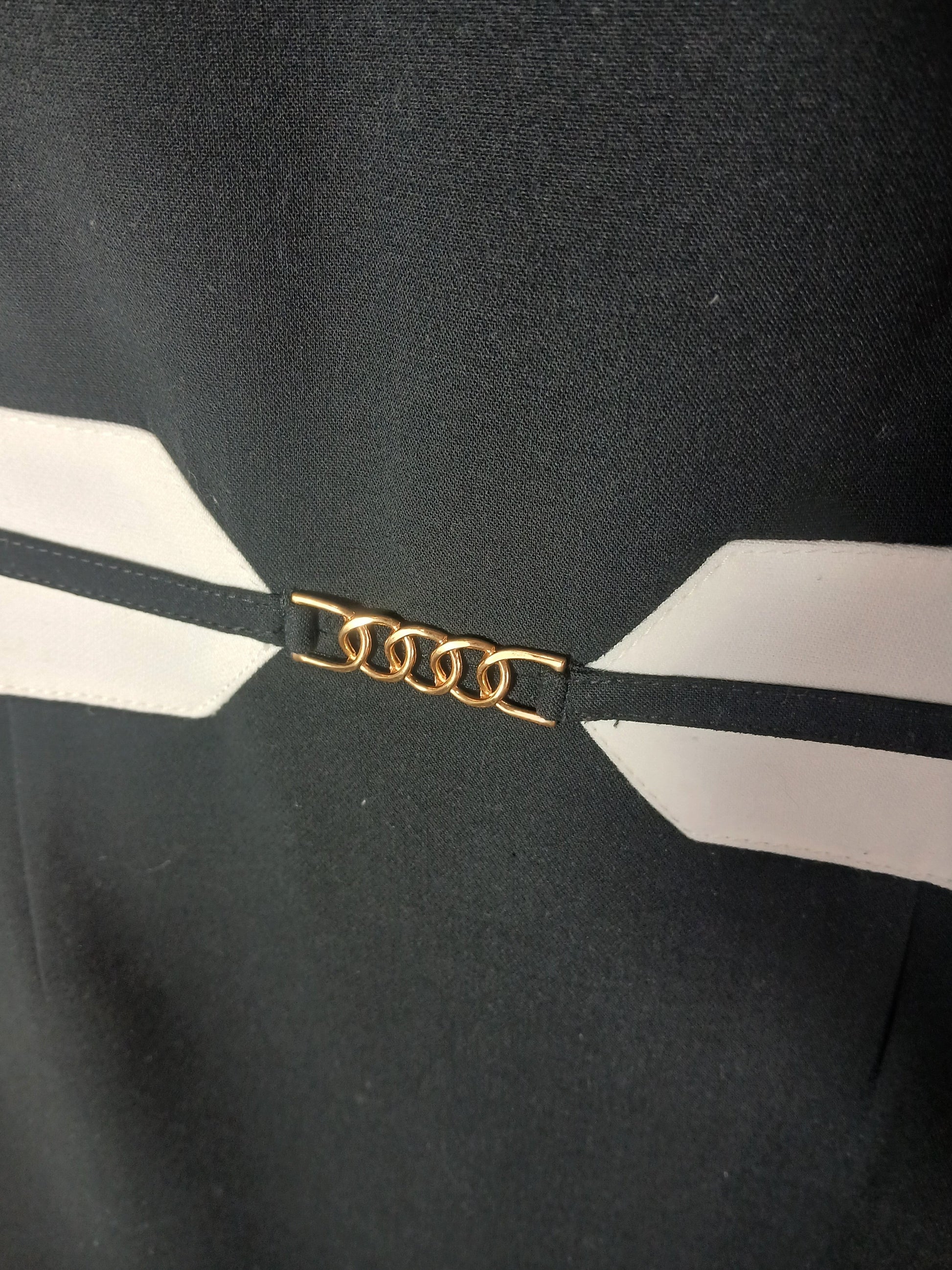 Department Store UK M&S black pencil dress featuring a white waist belt detail with a gold-tone chain clasp