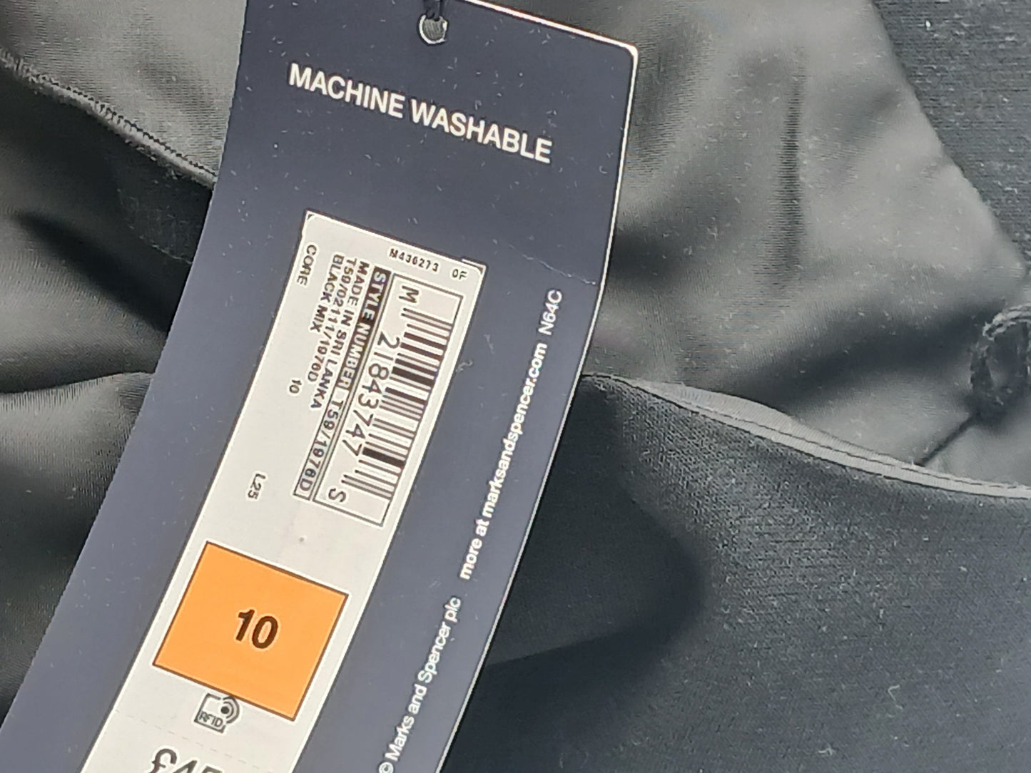 Department Store UK M&S black pencil dress tag showing size 10 and machine washable care instructions