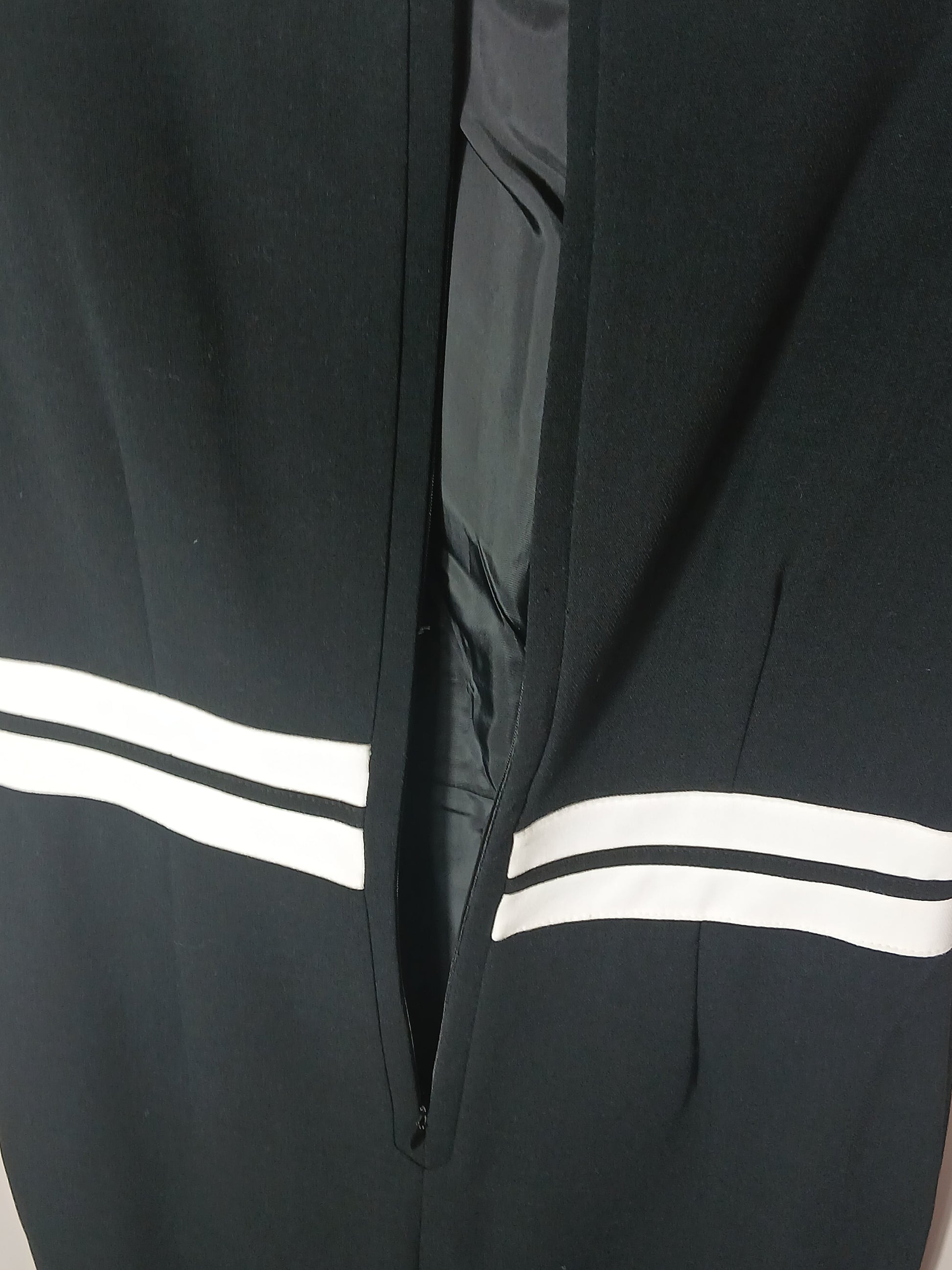 Department Store UK M&S black pencil dress featuring a white striped waist belt detail and back zip closure.