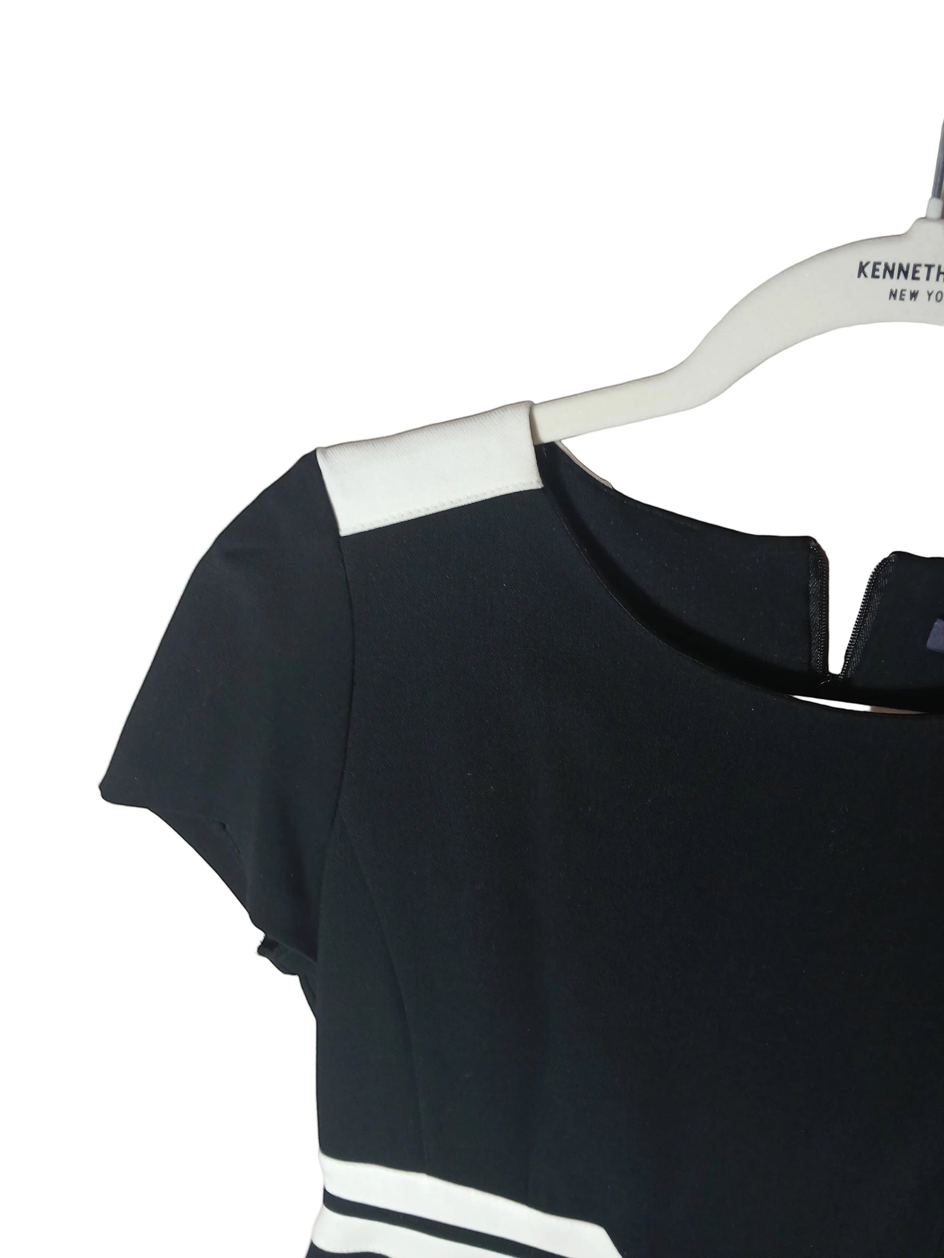 Department Store UK M&S black pencil dress featuring white shoulder and waist detailing on a hanger
