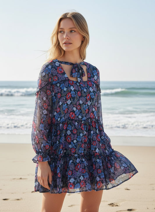 Department Store UK Mantaray floral print tiered mini dress with long sleeves on a beach model