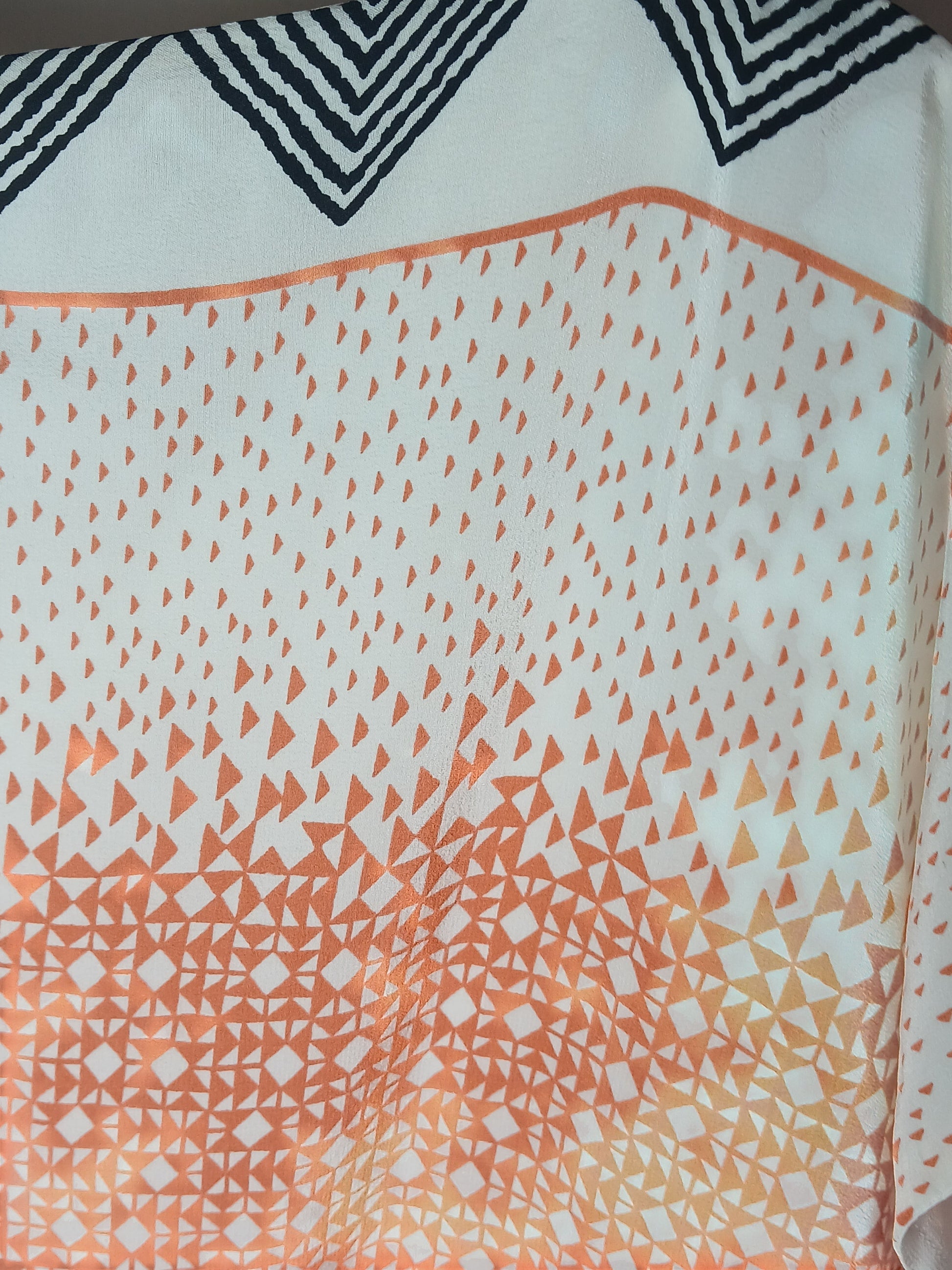 Department Store UK pre-loved HOBBS silk dress featuring a white fabric with orange geometric triangle print