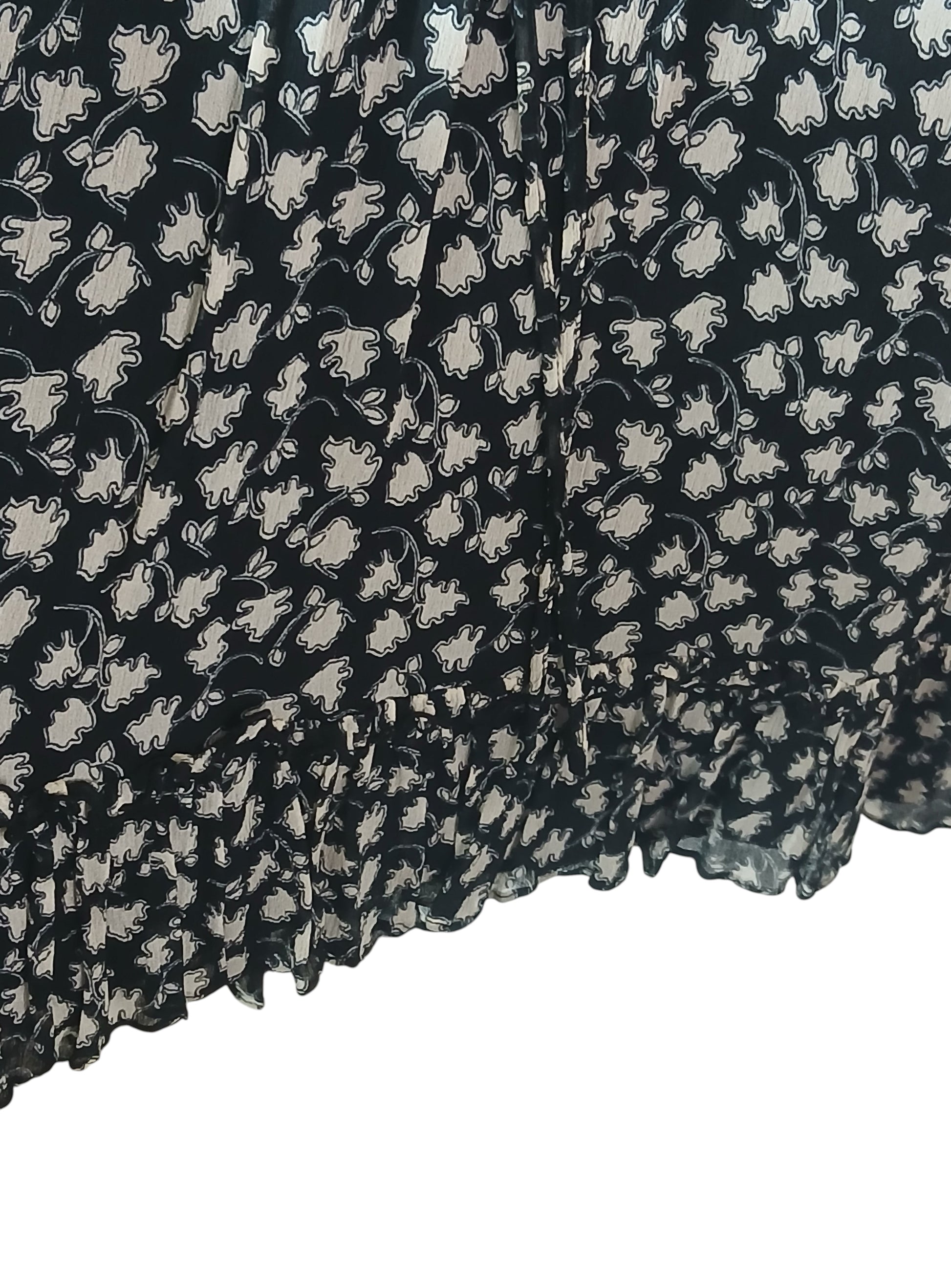 Department Store UK Jigsaw dress featuring a black and cream floral print with a ruffled hem detail.