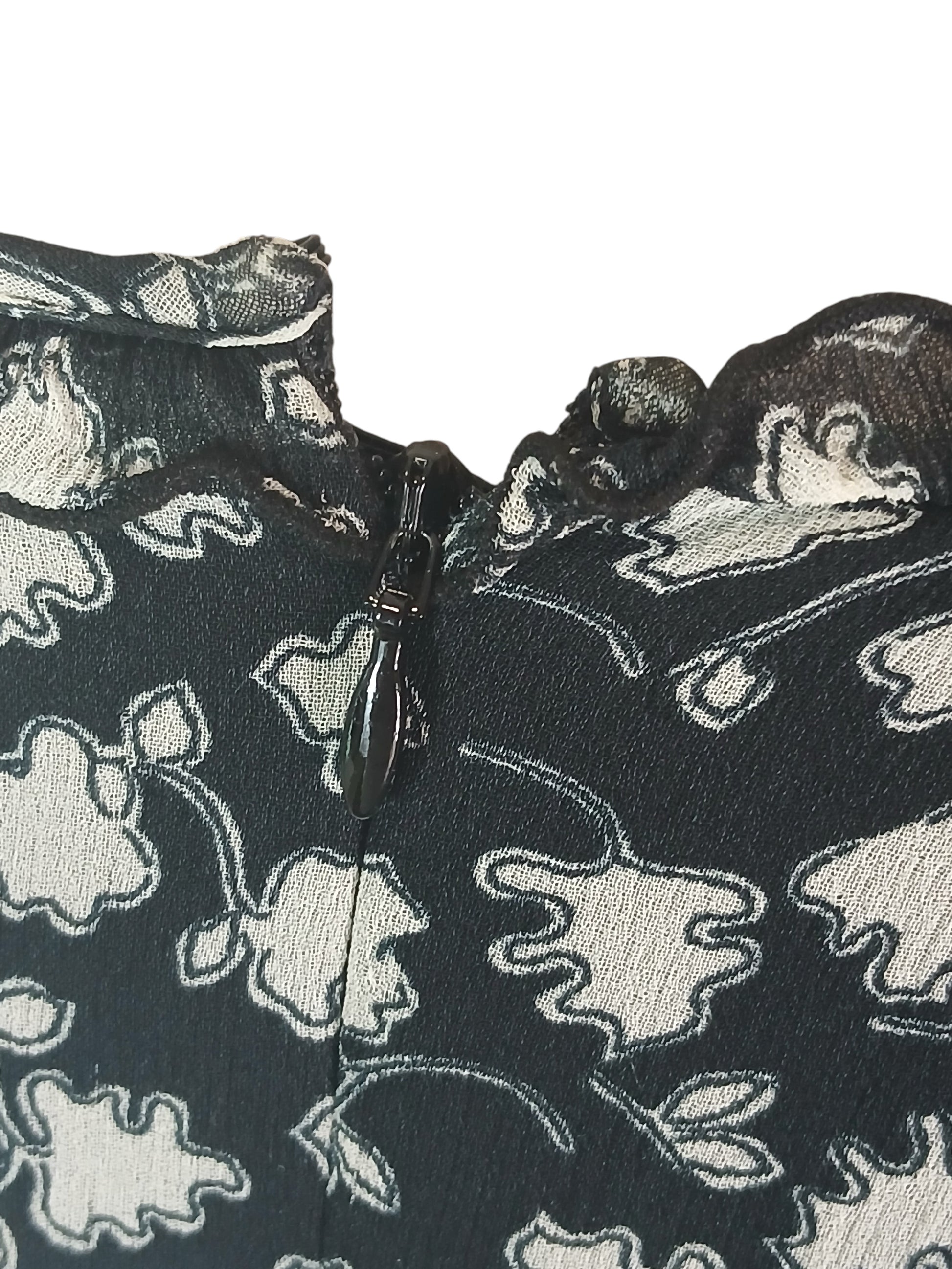 Department Store UK Jigsaw dress featuring a black and white floral print with a ruffled neckline and back zipper