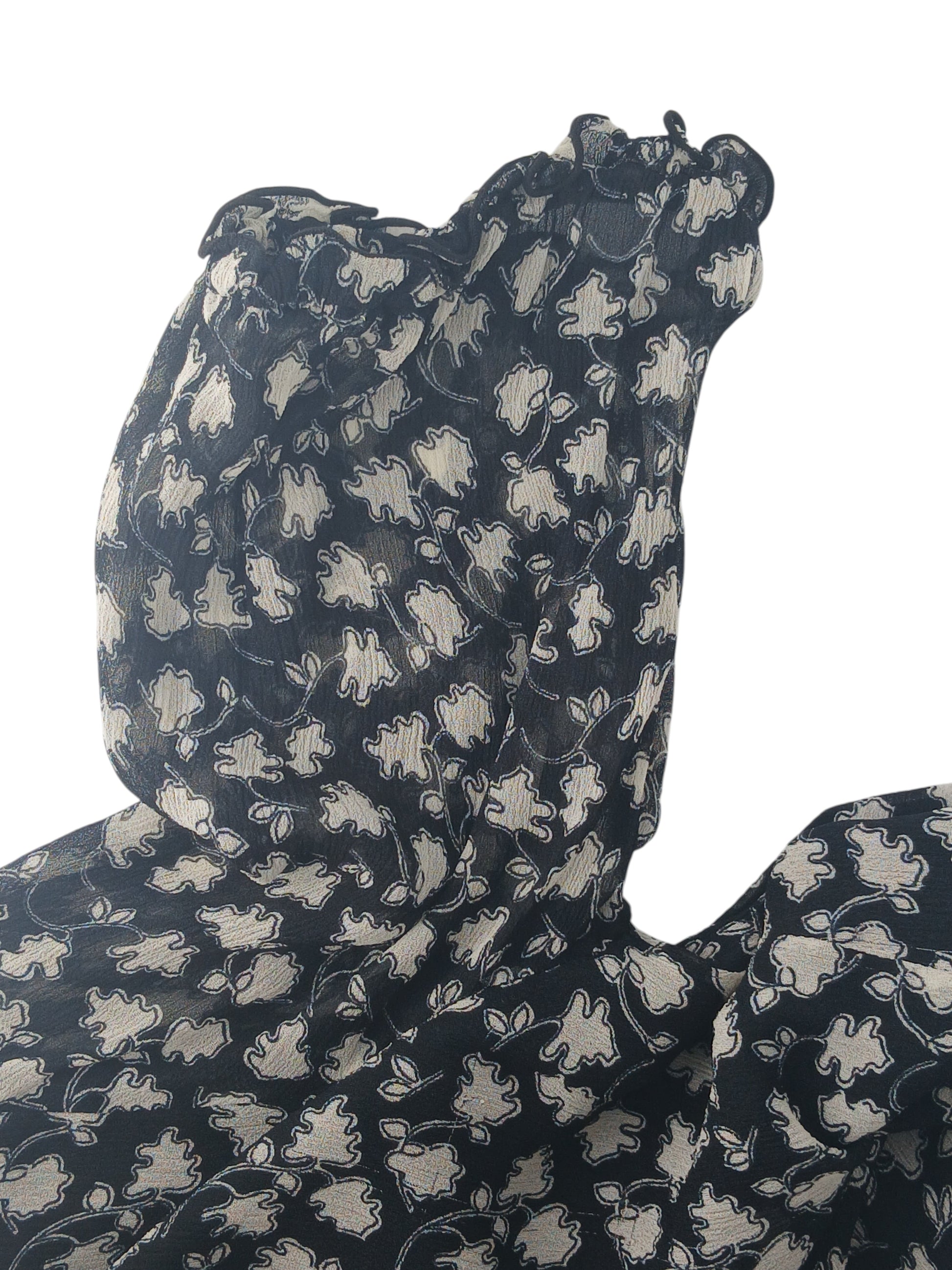 Department Store UK Jigsaw dress in black and cream with a floral pattern and ruffled neckline detail.