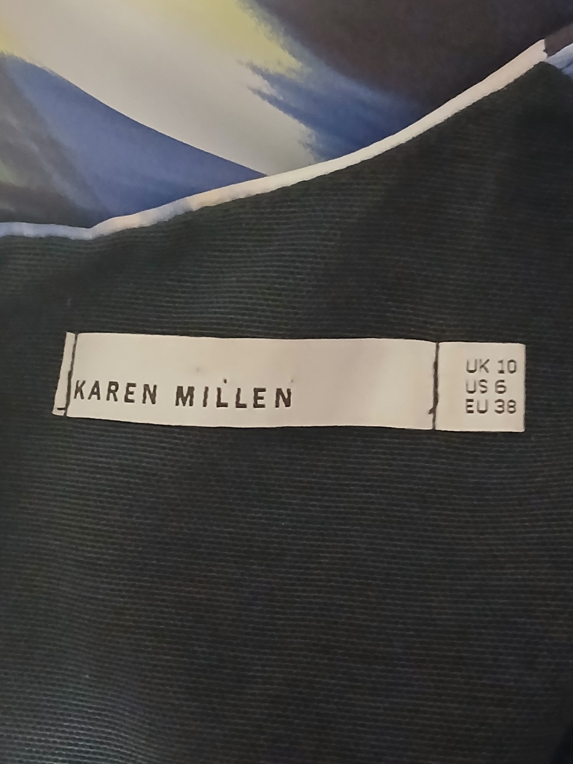 Department Store UK Karen Millen dress label showing UK 10, US 6, and EU 38 sizing on a dark fabric background