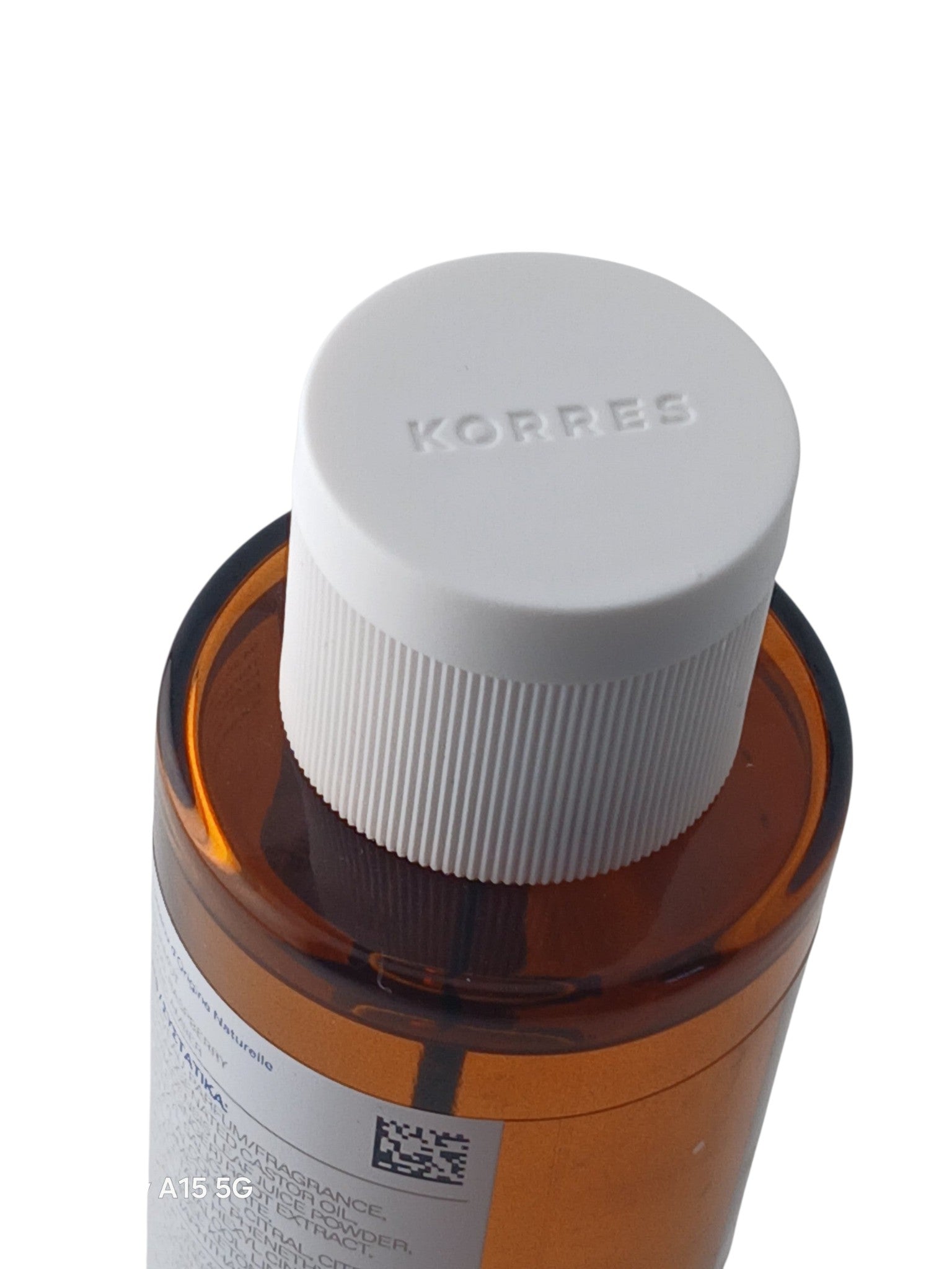 Department Store UK KORRES Midnight Dahlia body spray bottle with a white cap and amber glass, top-down view.