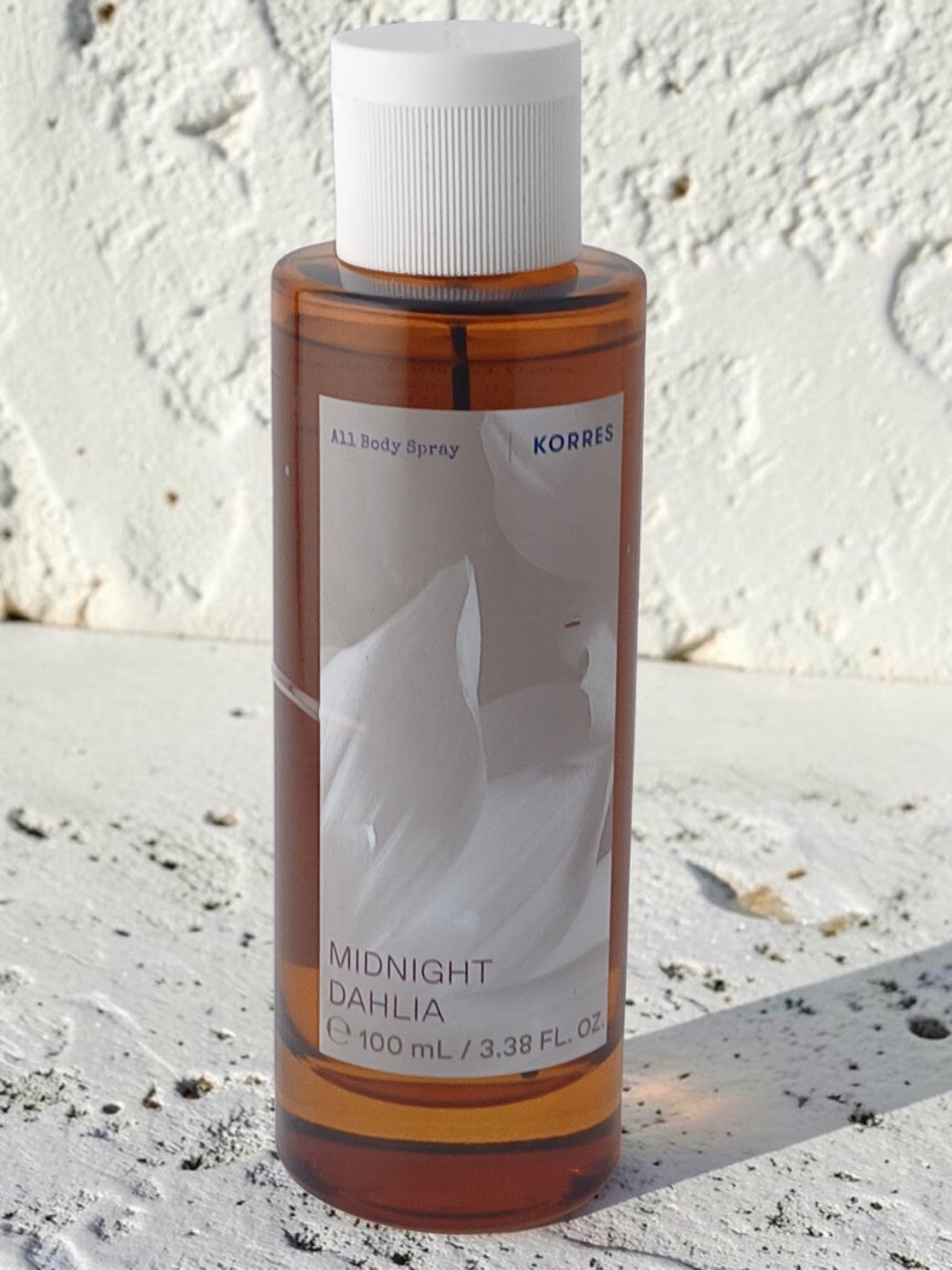 Department Store UK KORRES Midnight Dahlia 100ml body spray in a clear amber bottle with a white cap.