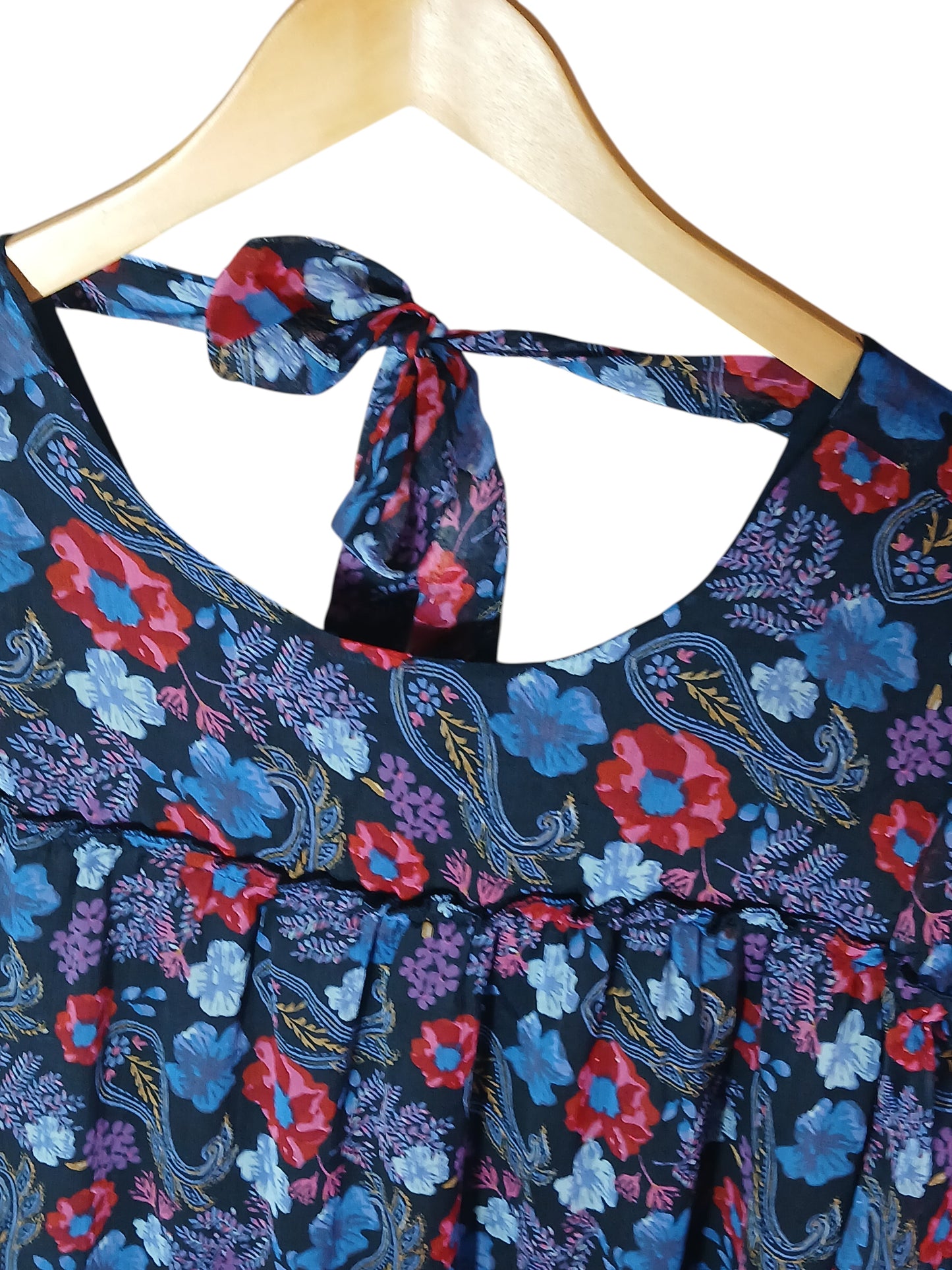 Department Store UK Mantaray floral print dress with a scoop neckline and back tie detail on a wooden hanger.
