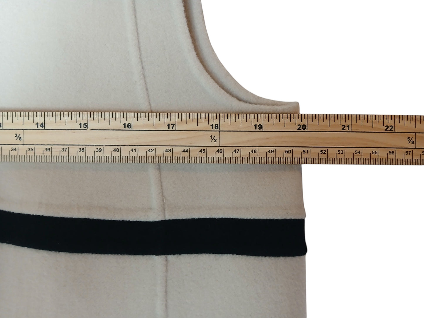 Department Store UK 'S Max Mara cream wool dress showing chest measurement with a wooden ruler
