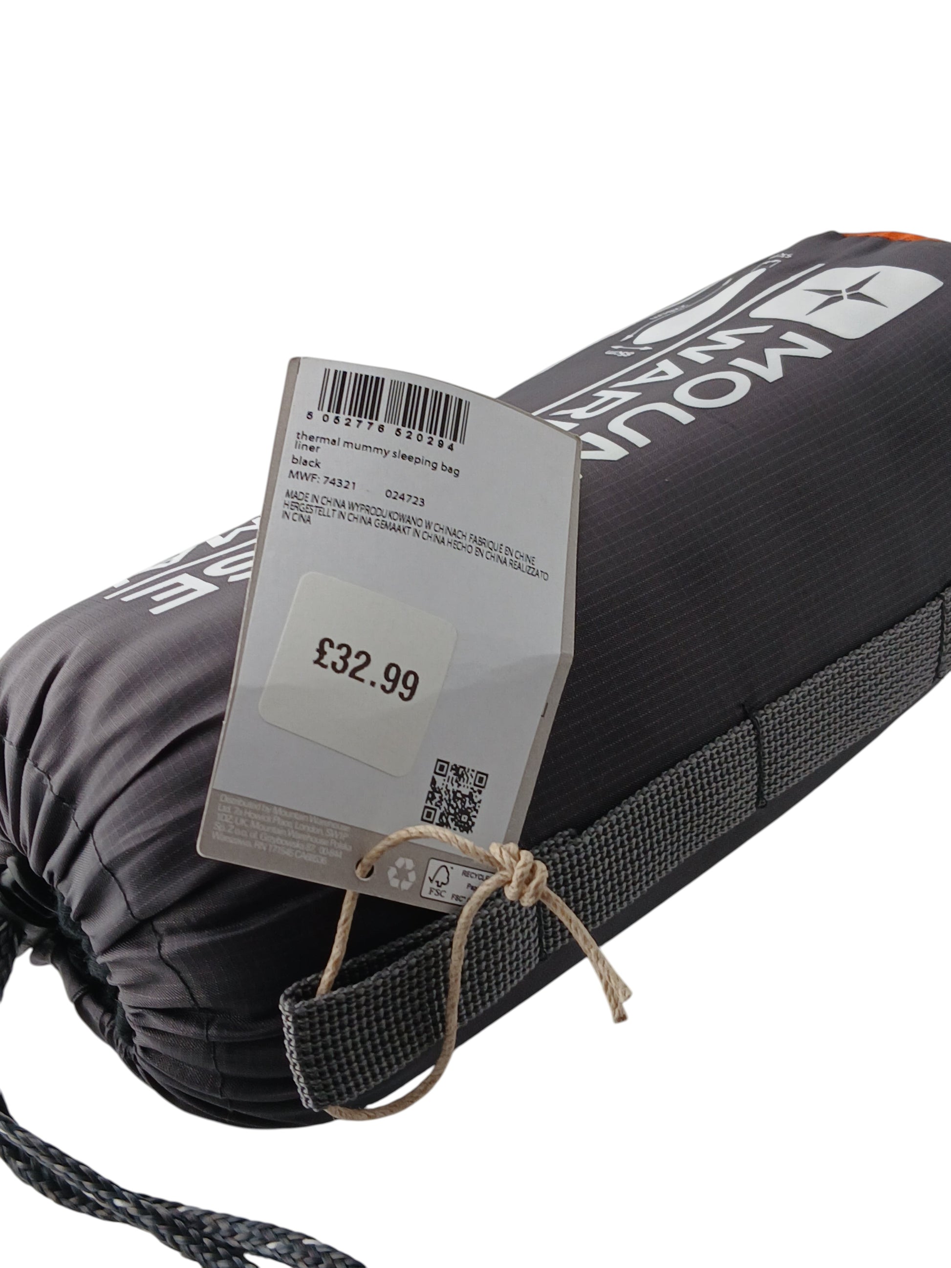 Department Store UK Mountain Warehouse thermal mummy sleeping bag liner in black, shown in its original packaging.
