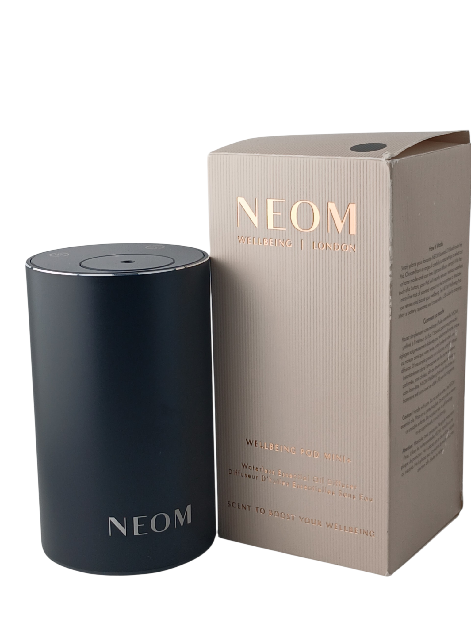 Department Store UK NEOM Wellbeing Pod Mini+ waterless essential oil diffuser in matte black with its product box.