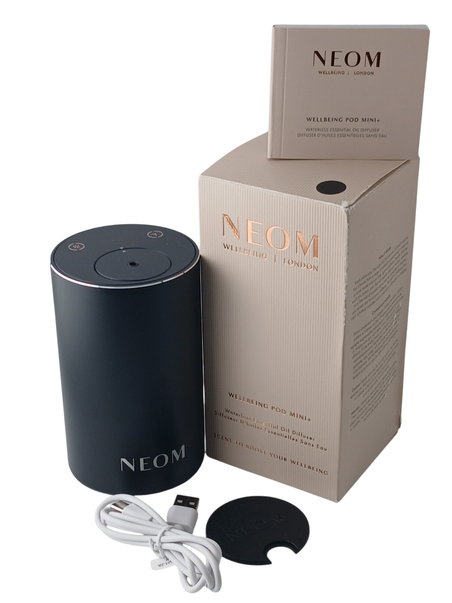Department Store UK NEOM Wellbeing Pod Mini+ waterless essential oil diffuser in matte black with packaging and cable