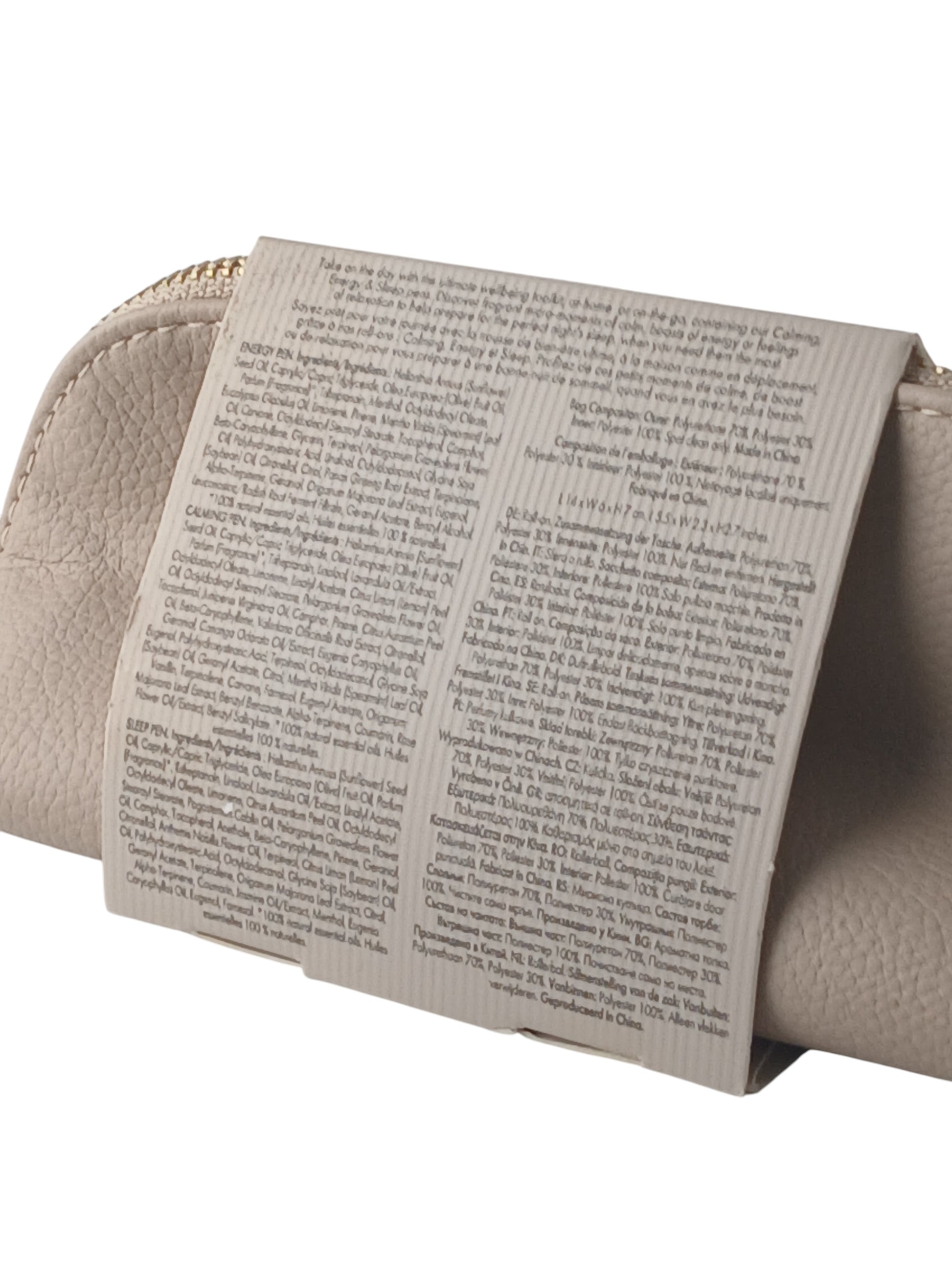 Department Store UK NEOM Wellbeing Pen Discovery Set product information label on a beige textured travel pouch