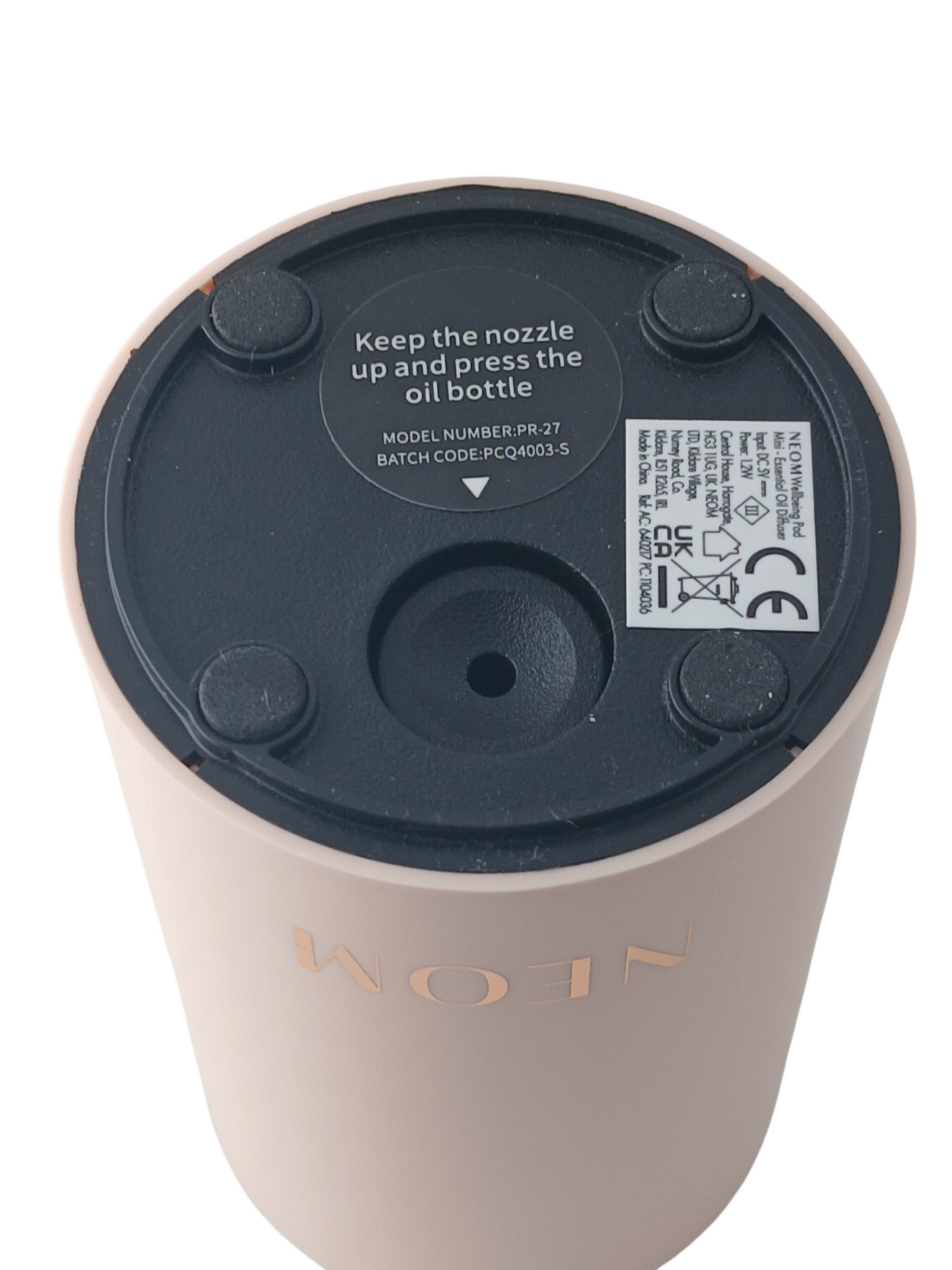 Department Store UK NEOM Wellbeing Pod Mini essential oil diffuser base showing product information and rubber feet