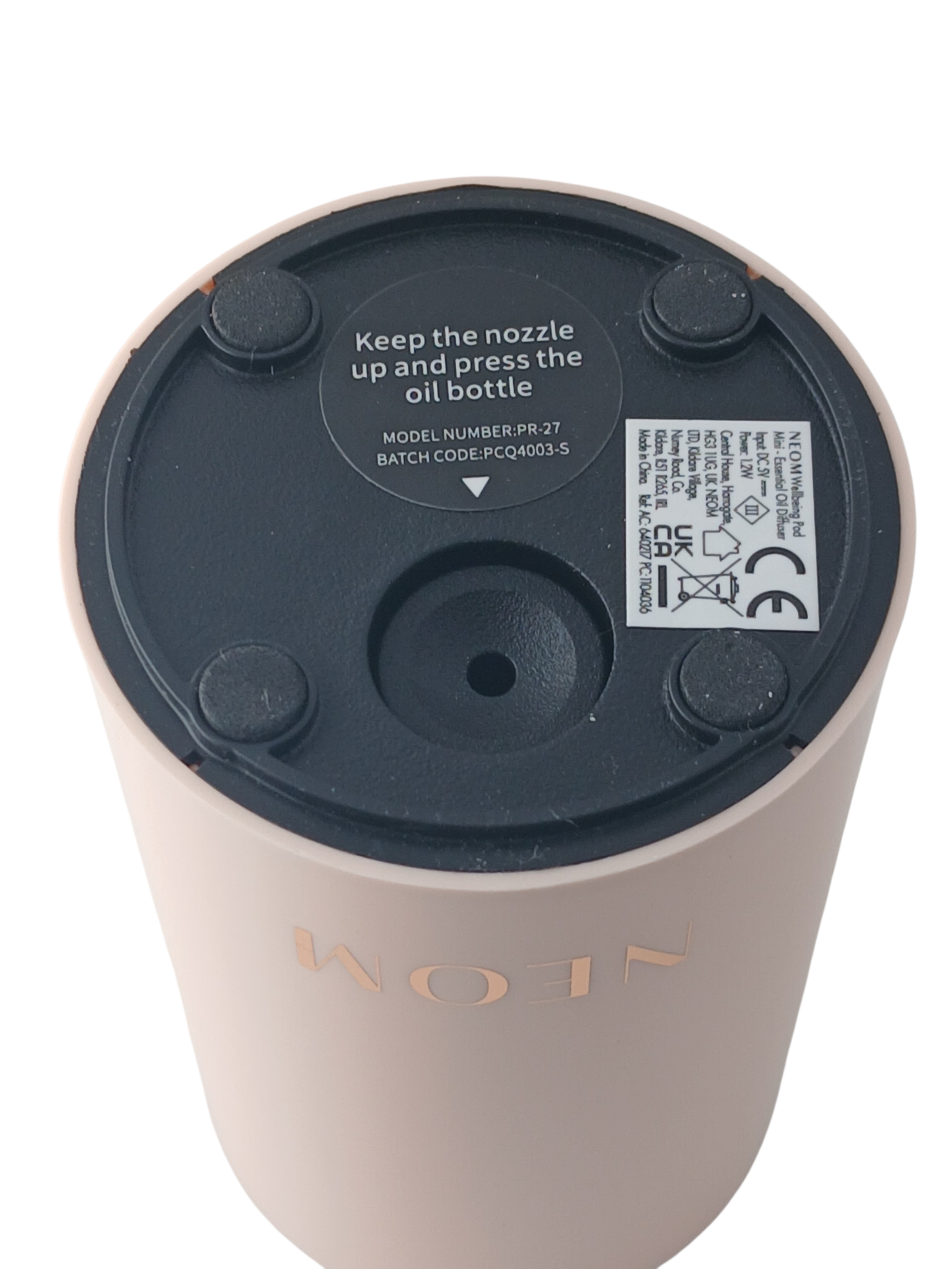 Department Store UK NEOM Wellbeing Pod Mini essential oil diffuser base showing product information and rubber feet