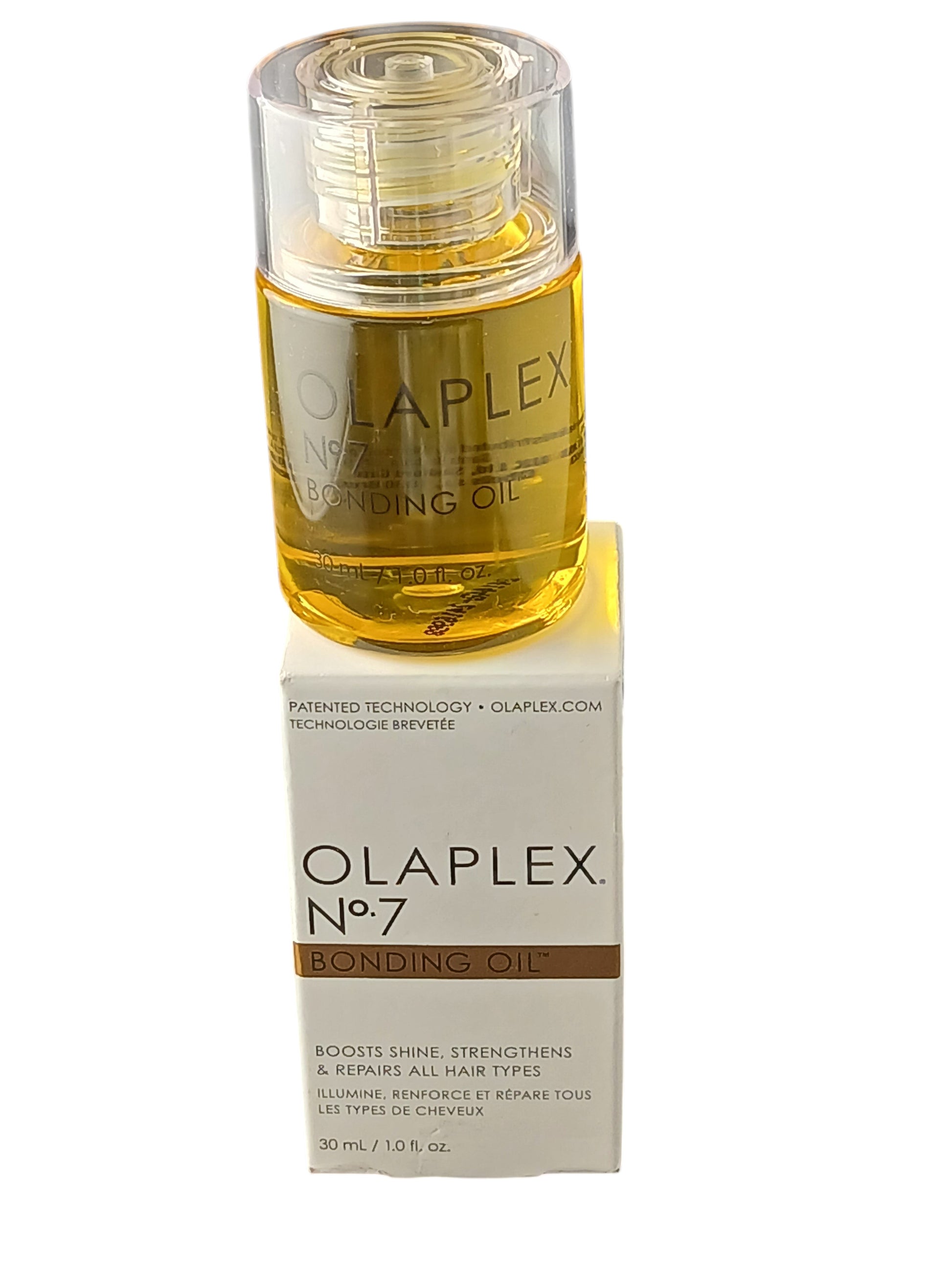 Department Store UK Olaplex No.7 Bonding Oil bottle and white product box on a black background