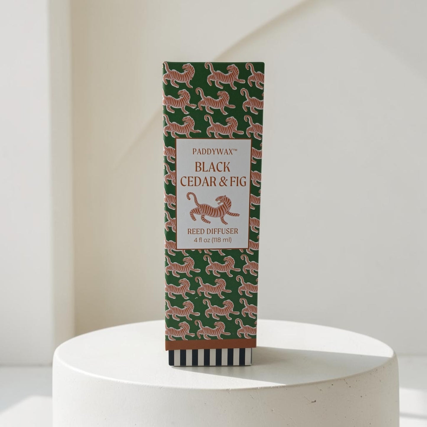 Department Store UK Paddywax Black Cedar & Fig reed diffuser in a green box with a decorative tiger pattern.