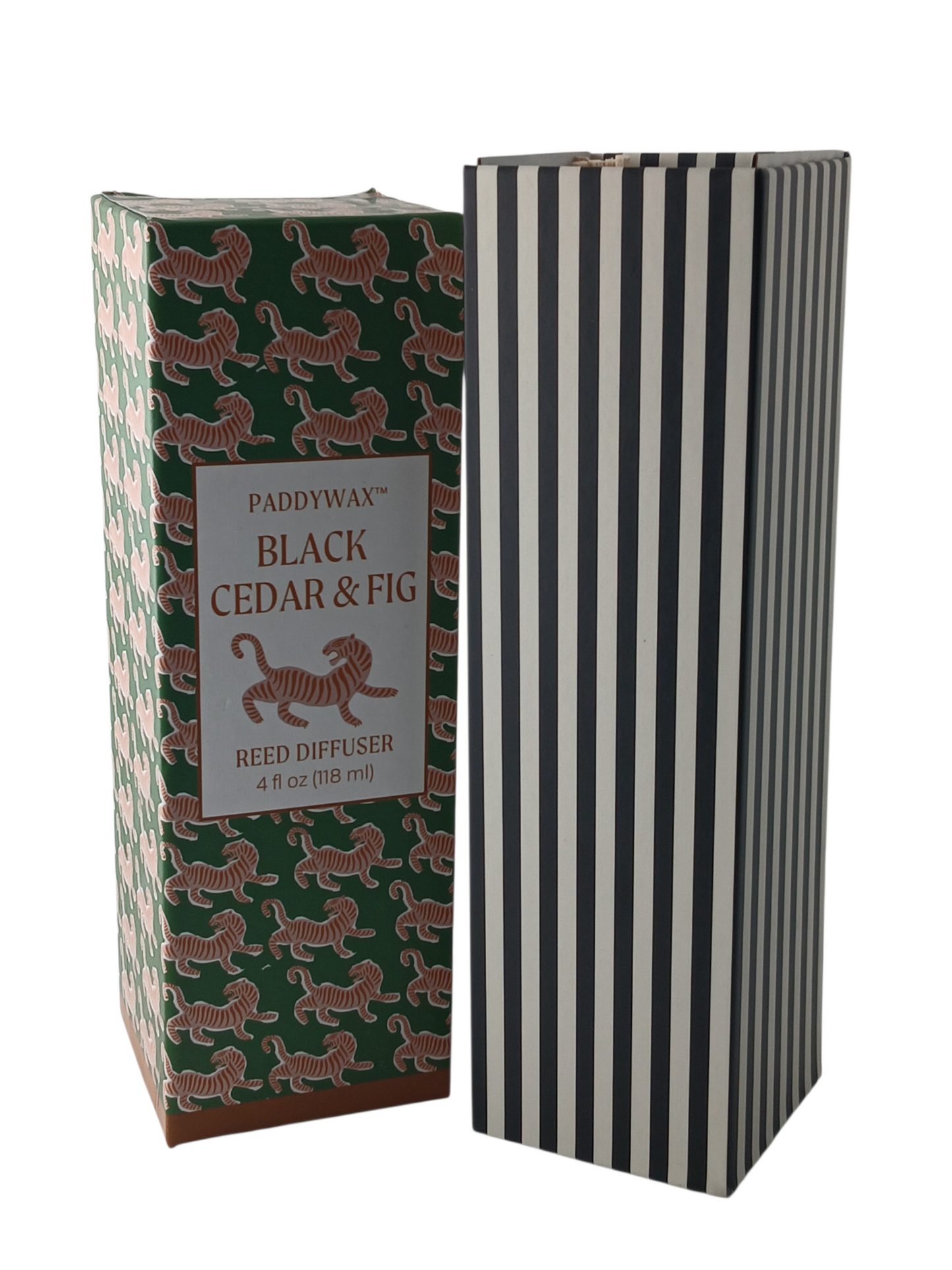 Department Store UK Paddywax Black Cedar & Fig reed diffuser in a green tiger print box next to a striped box.