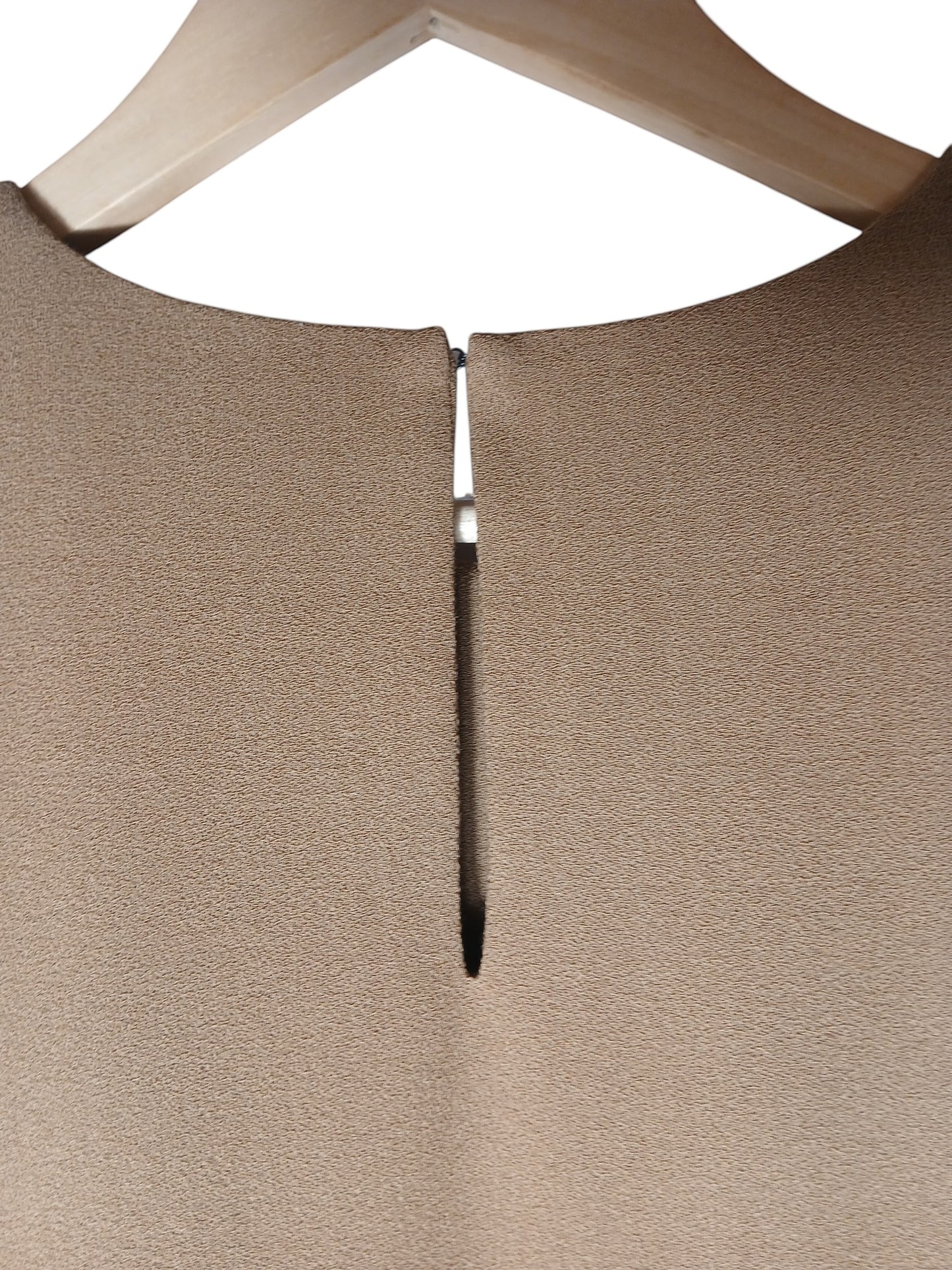 Department Store UK P.A.R.O.S.H. camel shift dress with a small slit neckline detail on a wooden hanger