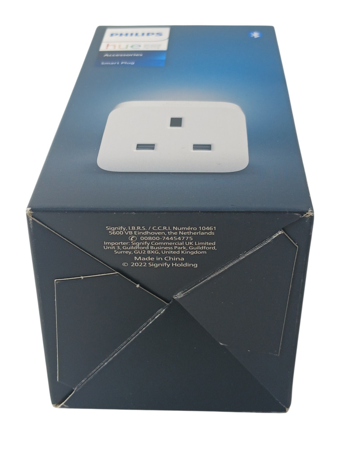 Department Store UK Philips Hue Smart Plug in its blue retail packaging, showing a white UK wall socket adapter.