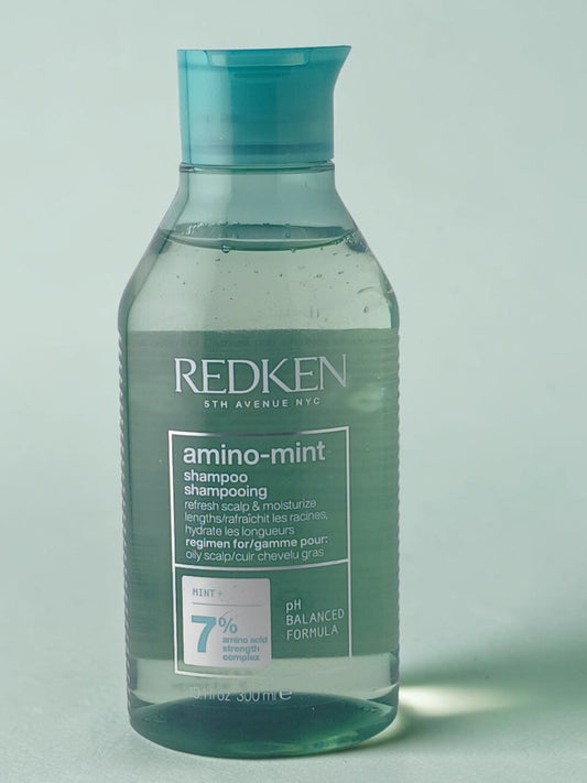 Department Store UK Redken Amino-Mint Shampoo in a clear bottle with a mint green cap for oily scalp care.
