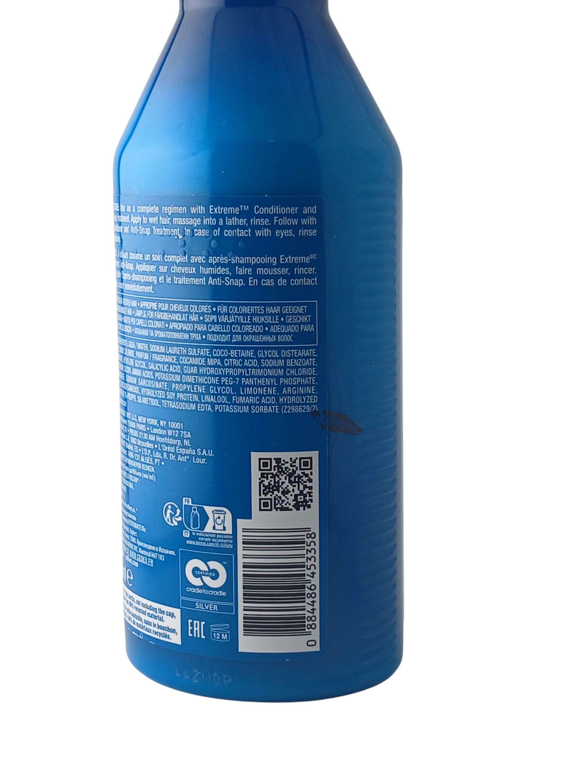 Department Store UK Redken Extreme shampoo bottle showing ingredient list and barcode on the blue plastic packaging
