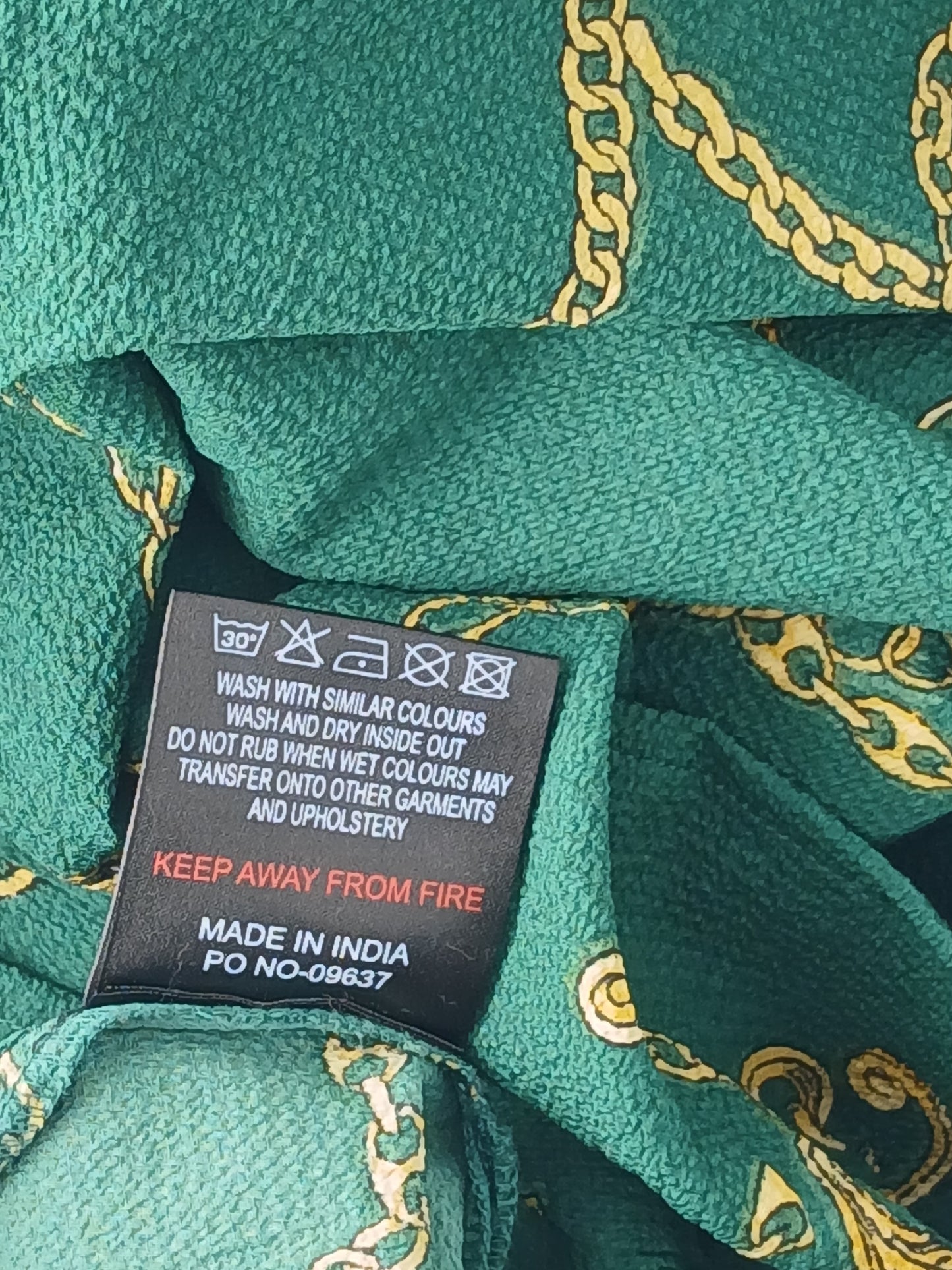 Department Store UK Sosandar blouse care label showing green and gold rope print fabric details
