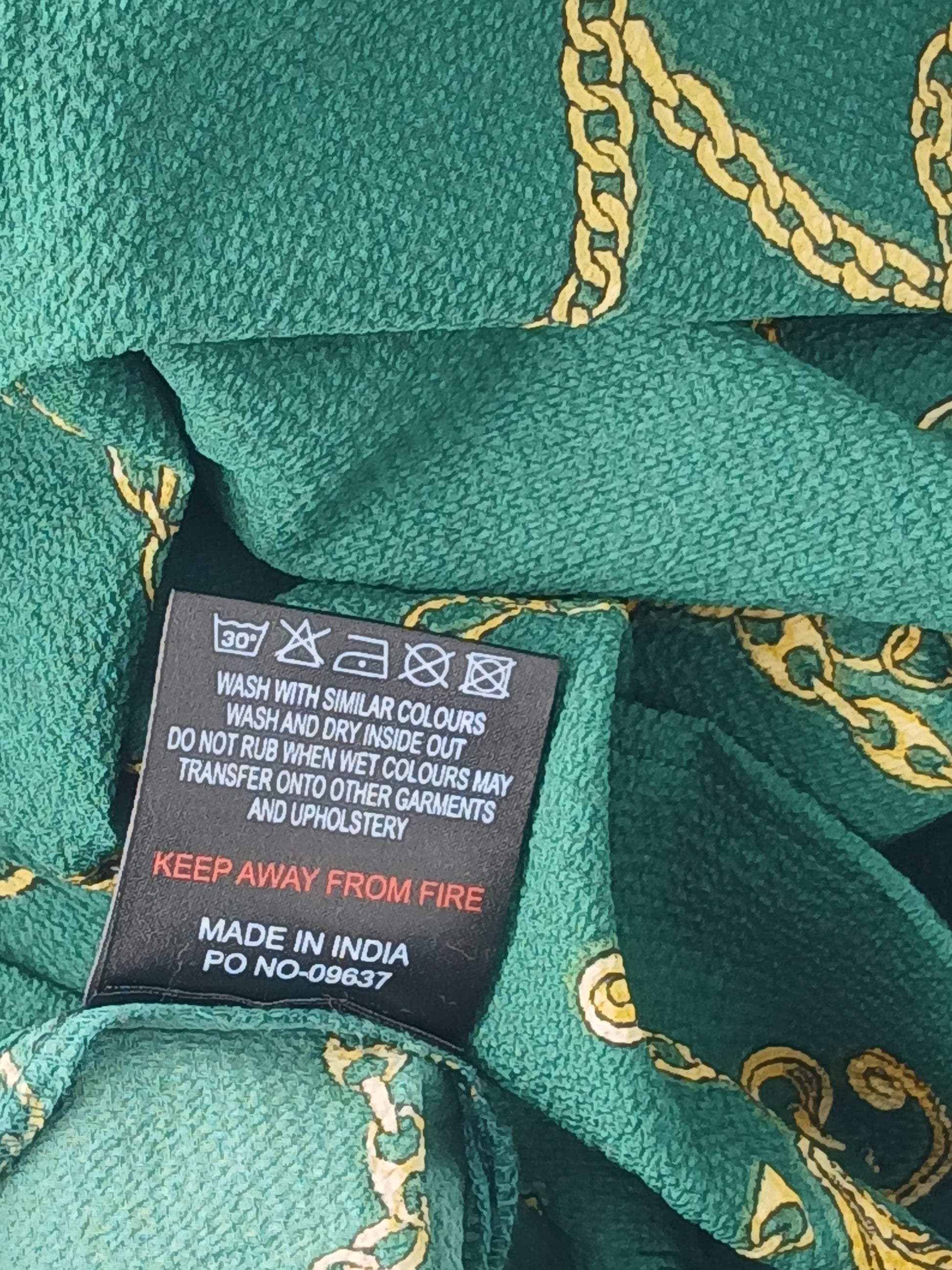Department Store UK Sosandar blouse care label showing green and gold rope print fabric details