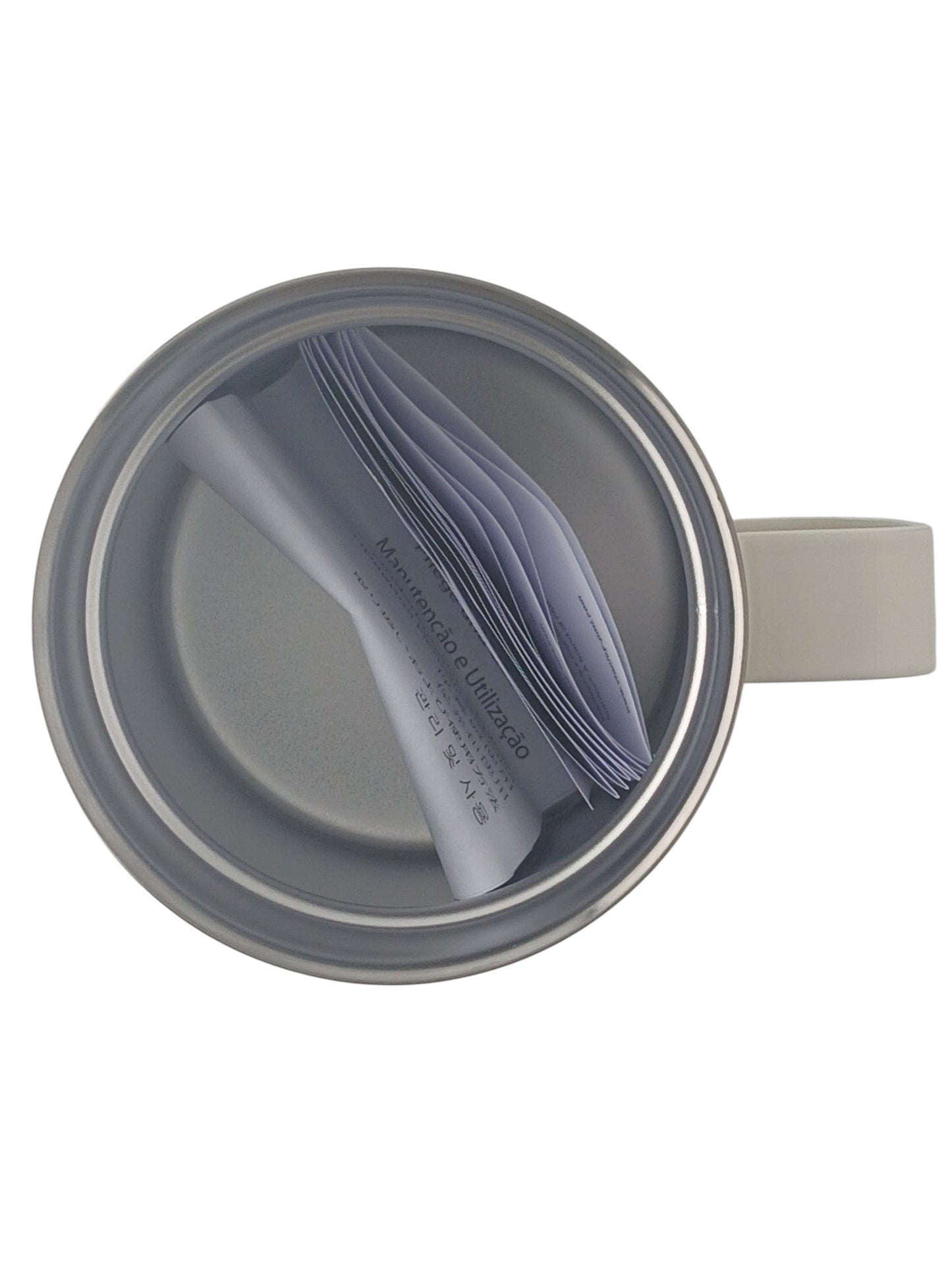 Department Store UK Stanley cream stainless steel camp mug viewed from above with instruction manual inside