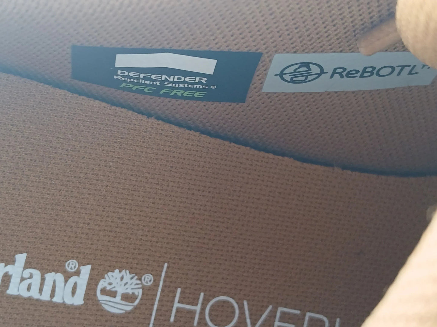 Department Store UK Timberland sneaker interior showing Defender Repellent Systems and ReBOTL fabric branding