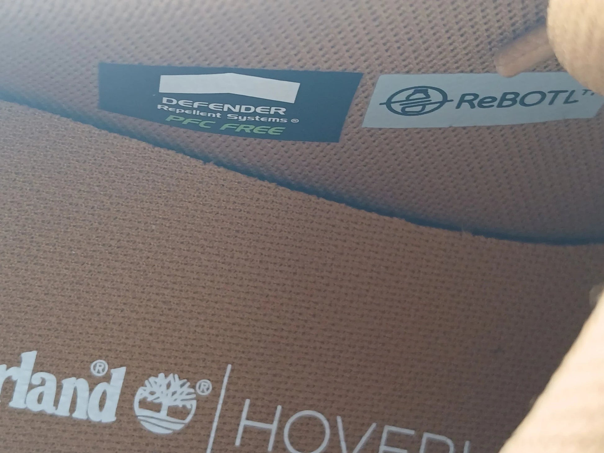 Department Store UK Timberland sneaker interior showing Defender Repellent Systems and ReBOTL fabric branding