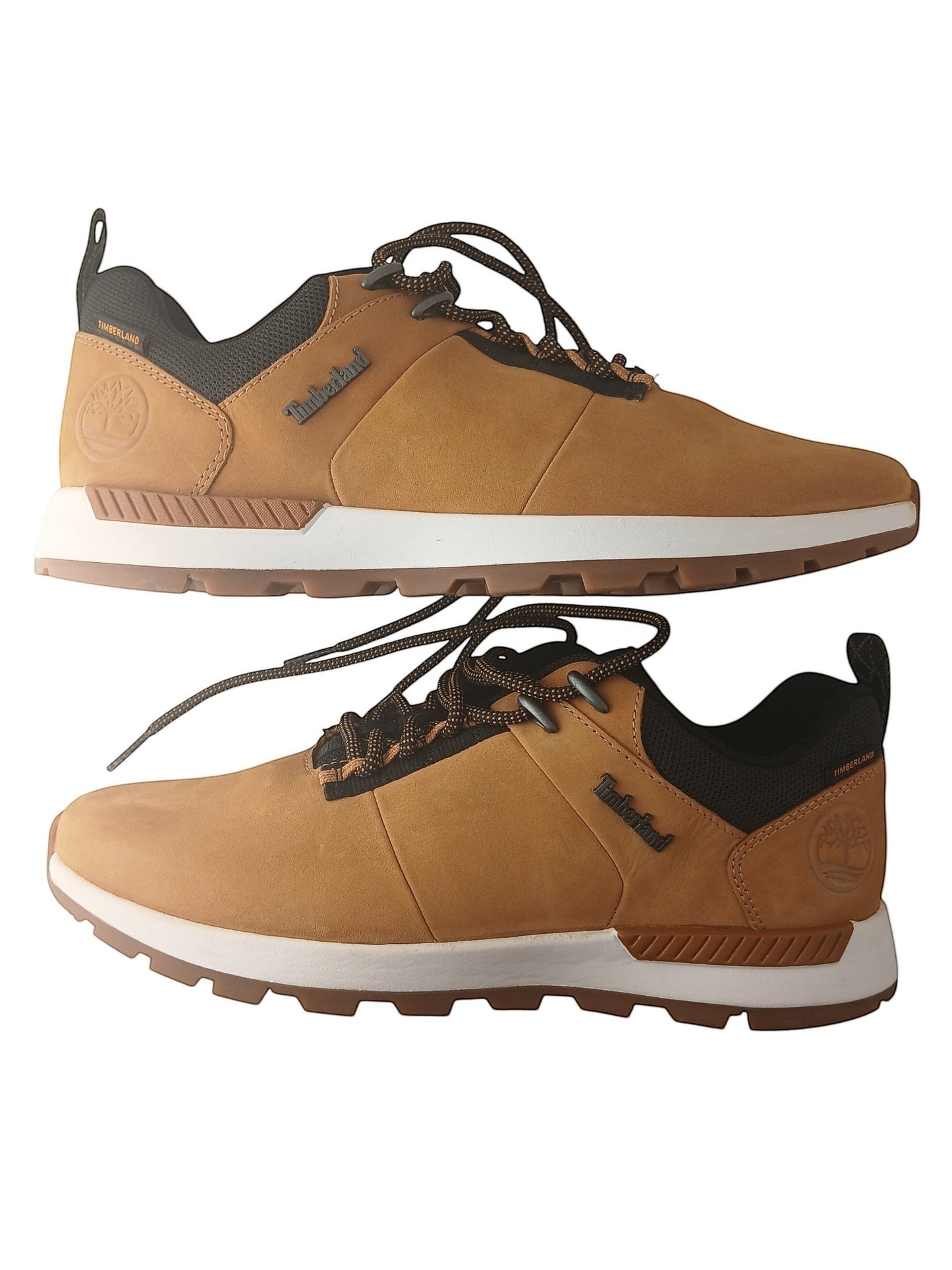 Department Store UK Timberland tan nubuck leather lace-up trainers with black mesh details and white rubber soles.