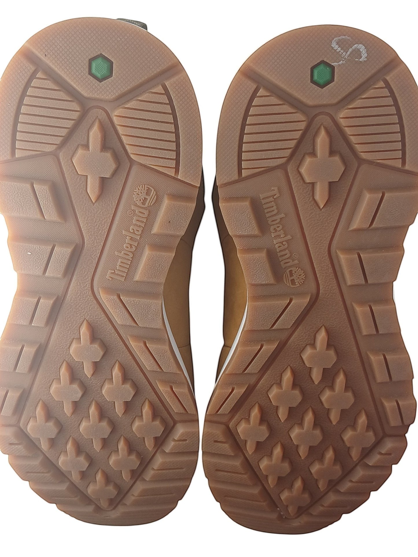 Department Store UK Timberland trainer rubber outsoles with high-traction tread pattern and embossed logo branding.