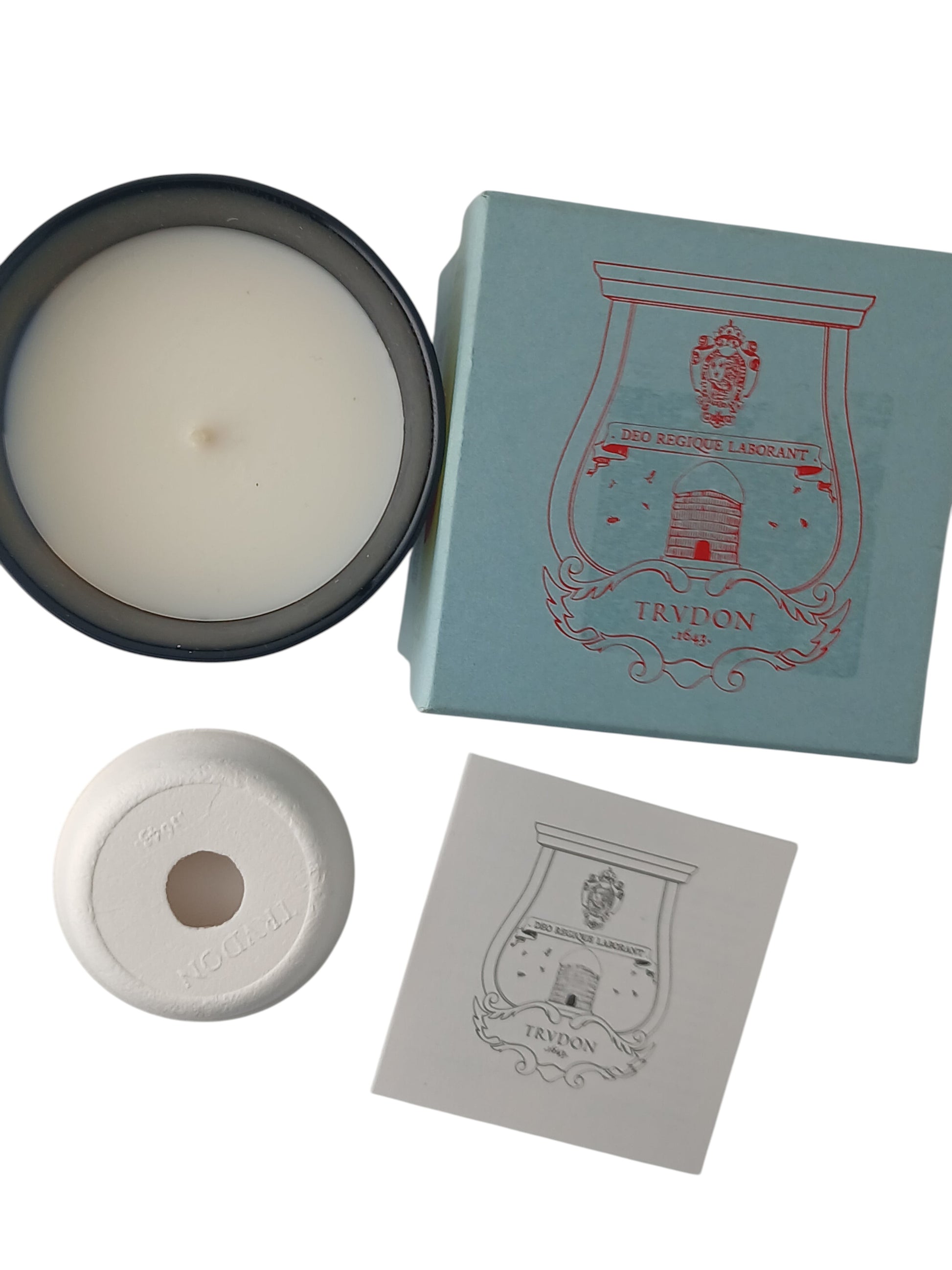 Department Store UK Trudon Gabriel scented candle with light blue box, white wax, and branded ceramic lid top view