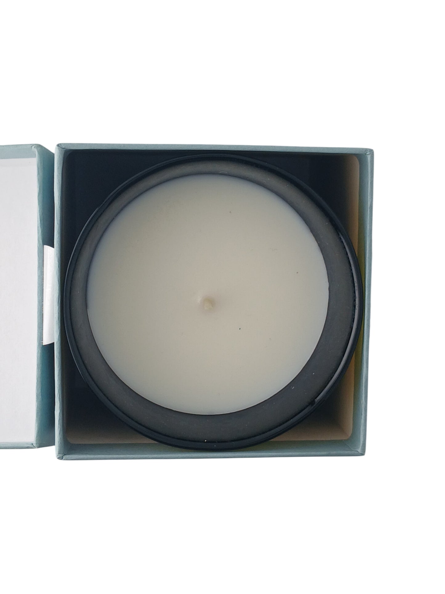 Department Store UK Trudon Gabriel scented candle in a dark glass vessel, viewed from above inside its box.