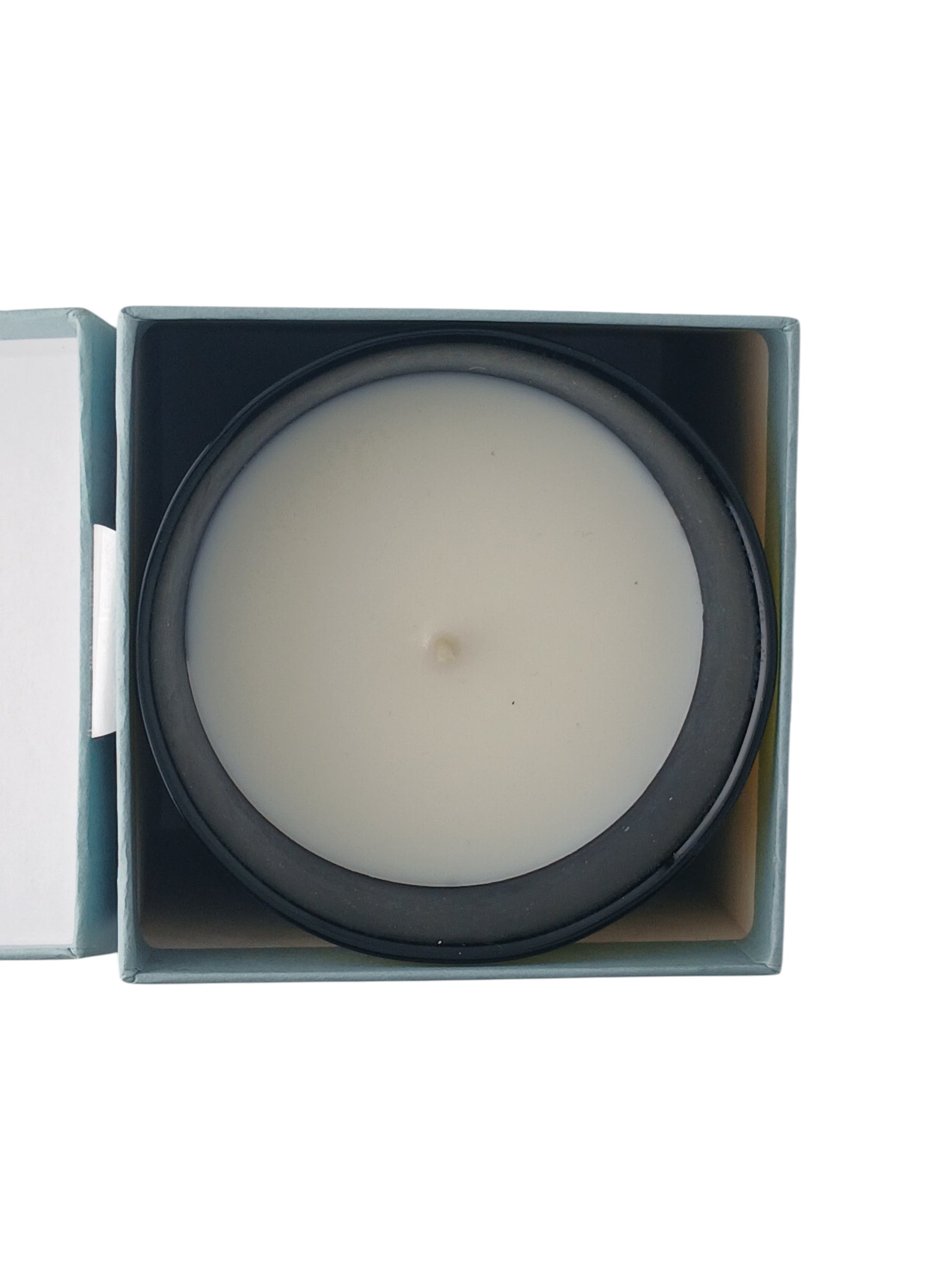 Department Store UK Trudon Gabriel scented candle in a dark glass vessel, viewed from above inside its box.
